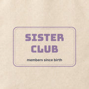 Close-up of the “SISTER CLUB” print on cotton canvas.