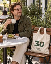 Carrynote thirty and thriving tote in a styled digital lifestyle image.