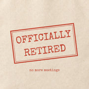 Close-up of the “OFFICIALLY RETIRED” print on cotton canvas.