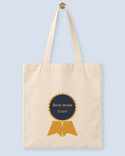 Natural canvas tote printed with “Best Boss Ever”, hanging on a wooden peg.