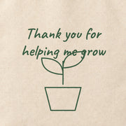 Close-up of the “Thank you for helping me grow” print on cotton canvas.