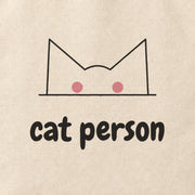 Close-up of the “cat person” print on cotton canvas.